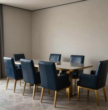 Interior of a refined private meeting room in Barcelona, featuring deep navy blue leather chairs and golden lighting accents, offering a sense of calm and discretion.