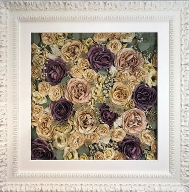 a flower wall style preserved wedding bouquet in an ornate frame