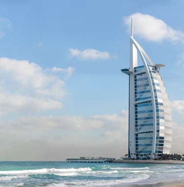 Dubai ,a tall building with a tall tower in the background