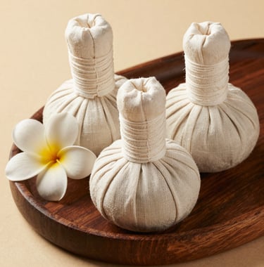 A beautiful flat-lay photograph of organic herbal compress balls wrapped in natural linen, placed on a dark wooden tray next to a single white plumeria flower. Relaxing spa theme with warm earth beige tones.