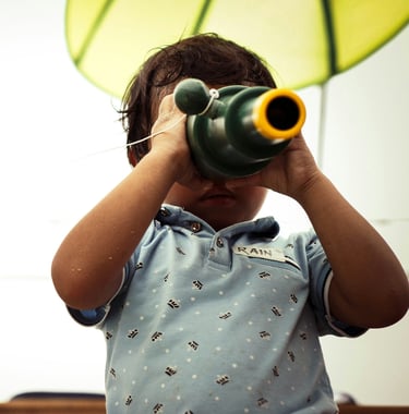 Kid exploring with a magnify glasses