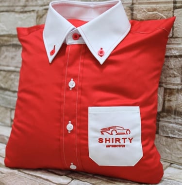 a red pillow designed as shirt with white collar and pocket