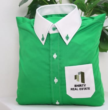 a green shirt with white collar and pocket as pillow