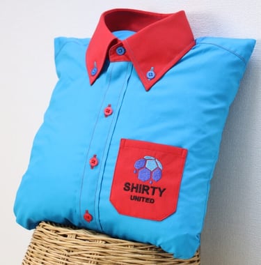 a blue shirt with red collar and pocket as pillow
