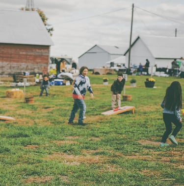 group of kids playing at outdoor fall festival in Knoxville illinois