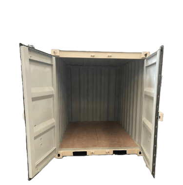 Open beige steel shipping container with a plywood floor for storage and transport.