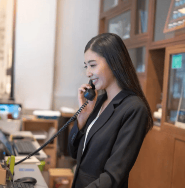 Concierge answering a guest call — part of Vision Immo Bali’s personalized villa management service