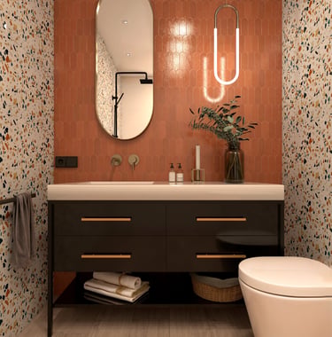 Modern bathroom with terracotta picket wall tiles, terrazzo wallpaper, and a black floating vanity.