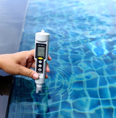 Digital water testing device checking pool chemical levels—part of Piscus Pools’ precise maintenance service.