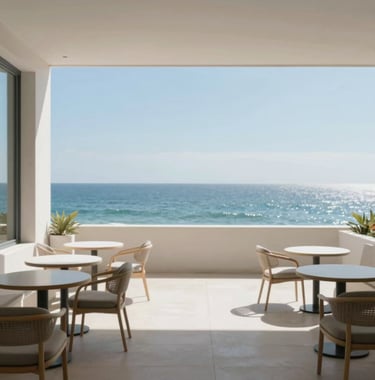A wide view of a minimalist boutique hotel terrace overlooking the ocean, clean lines, elegant furniture, aspirational and tranquil mood using #A8C9CF.