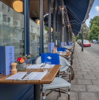 a restaurant with a table and chairs outside