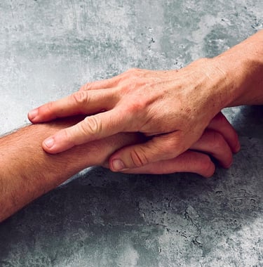 a man holding a hand of another hand