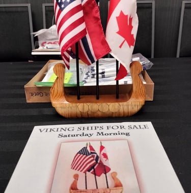 viking ship centerpiece with American, Canadian and Norwegian flags