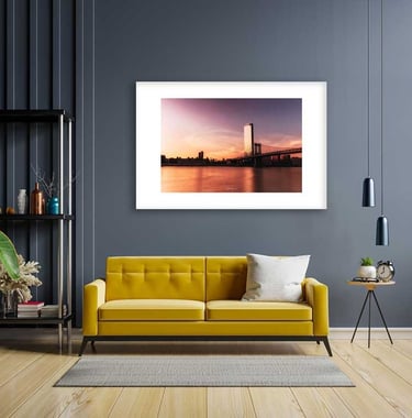 a couch in a living room with a picture frame