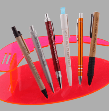 a pen and a pen on a red tray