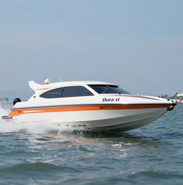 Dynamic low-angle shot of the Maruti Duta II fast boat cutting through waves near Sanur harbor. The boat is pristine white with professional orange and navy livery (#D36B31, #1B2D3B). The image feels fast, reliable, and modern.