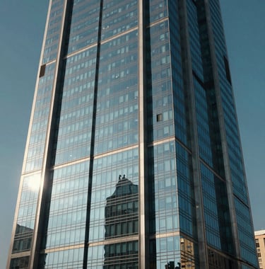 Cinematic exterior shot of a modern glass skyscraper facade reflecting the clear blue sky of Egypt. Sharp lines, architectural detail, and a sense of premium quality and technological advancement.