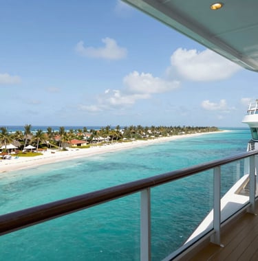 A high-end cruise ship balcony view overlooking a turquoise North American tropical bay with white sandy beaches in the distance, captured in bright, inviting midday light.