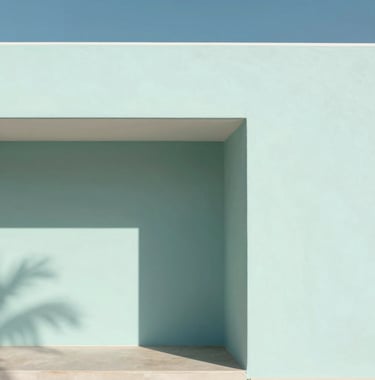 A minimalist architectural detail of a coastal villa. Strong shadows against a #FAF8F5 wall with a hint of a #7E8A7F plant leaf visible. Clean lines and high contrast.