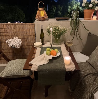 Cozy balcony with warm ambient lighting and natural wooden textures, inspired by warm European outdoor living