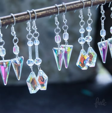 Glass prisms create rainbow effects on and near wearer. 