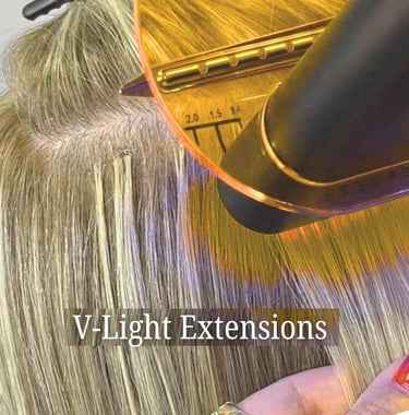 Professional application of V-Light hair extensions using a specialized UV bonding tool on blonde hair.