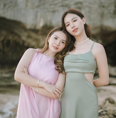 Portrait of two friends posing together near cliff during photoshoot at Geger Beach Nusa Dua Bali