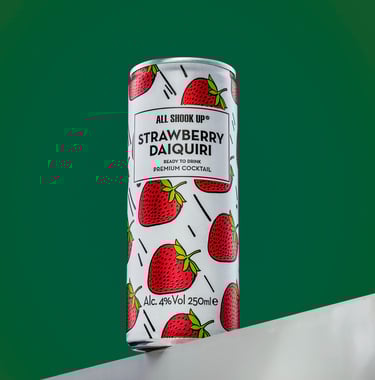 Can of strawberry cocktail on a shelf