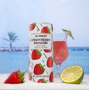 Strawberry canned drink on a beach