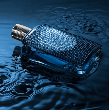 Bottle of perfume laying in water