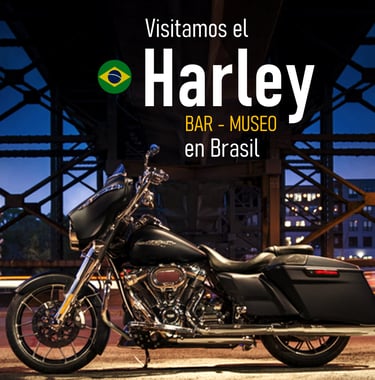 a motorcycle parked in front of a bridge