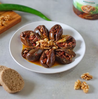 a plate of chocolate covered stuffed peppers and nuts