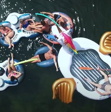 a group of people are floating in the water