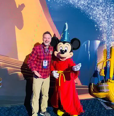 Chris Breedlove pictured with Mickey Mouse at the Disneyland® Hotel.