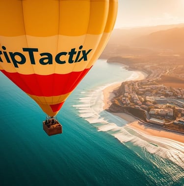 A TripTactix hot air balloon flying over a scenic coastline at sunset near a beach resort.