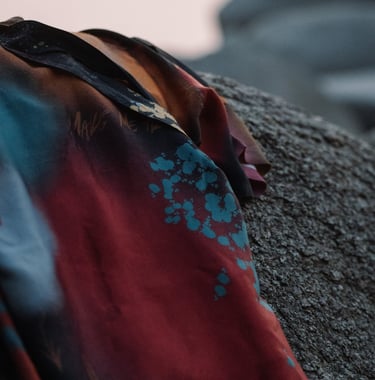 Close-up of the fabric of a Boho Graffiti Kimono, showcasing its vibrant, artistic design and rich c