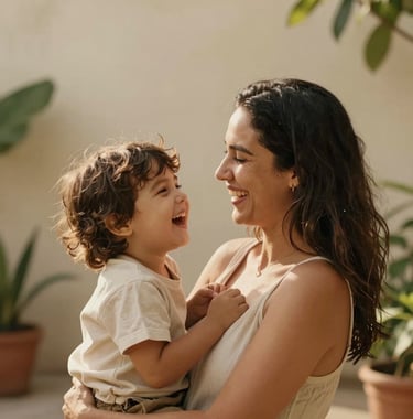 A candid, warm-toned photograph of a mother and child laughing in a South American / Brazilian sun-drenched garden. Soft focus, warm sandy beige highlights, minimalist composition.