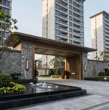 Exterior photography of the grand entrance of a premium high-rise residential complex in Greater Noida. Modern landscaping, elegant water feature, and slate grey stone walls. Clear day. South Asian / Indian.