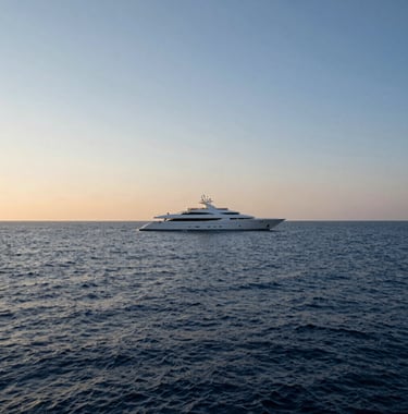 A luxury sailing yacht on the horizon of a calm, deep blue sea during the golden hour. The image emphasizes tranquility and elite travel. Global / Sophisticated Traveler mood.