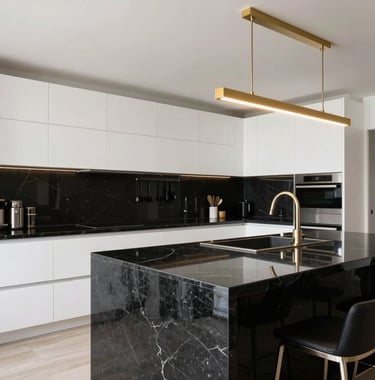 A high-end modern kitchen interior in a South American / Ecuadorian home. Black granite island, sleek white cabinetry, and gold lighting fixtures. Professional interior photography, bright and luxurious.