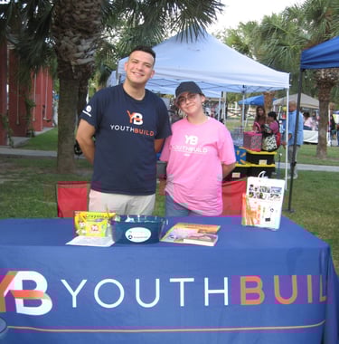 two staff member of youth build by cdcb