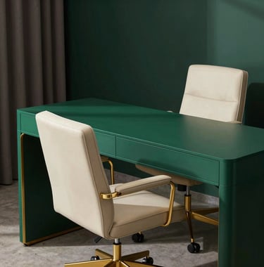 A contemporary home office with a minimalist royal dark green desk, a cream leather ergonomic chair, and gold hardware accents.
