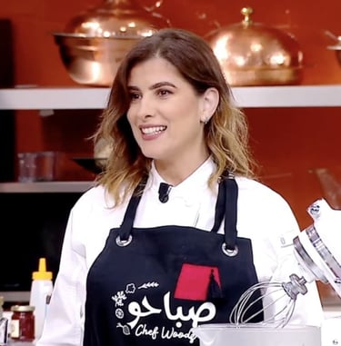 Well-known chef in a unique apron designed just for her