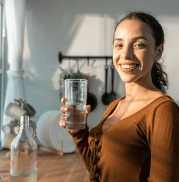 woman hydrating with water