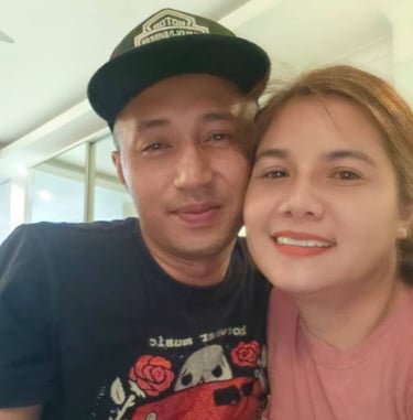 couple looking at camera cheek to cheek