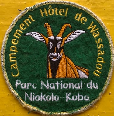 Embroidered souvenir patch for Campement Hôtel de Wassadou at Niokolo-Koba National Park featuring an antelope.