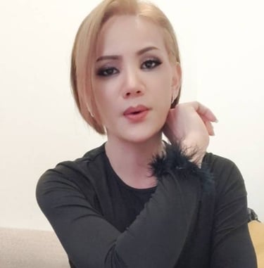 ladyboy with short blonde hair and black top ready for outcall massage
