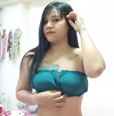 Lady wearing a bikini while on her knees on a bed