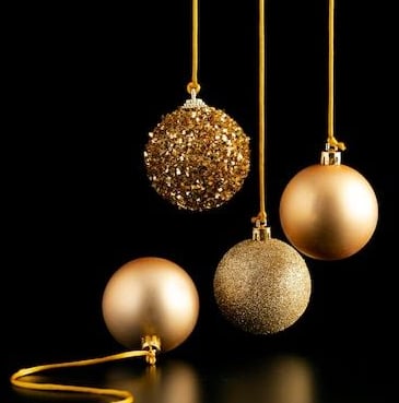 christmas ornaments hanging from a gold chain