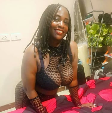 Black lady wearing sexy black bra and fishnet outfit